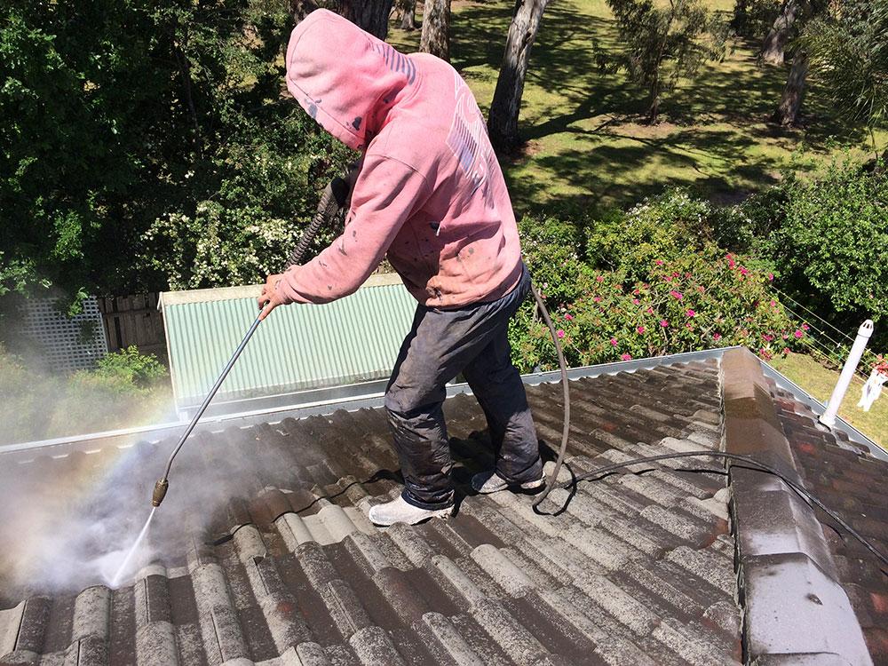 cleaning a dirty roof